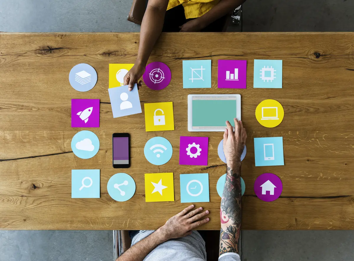 Group of computer icons on a wooden table