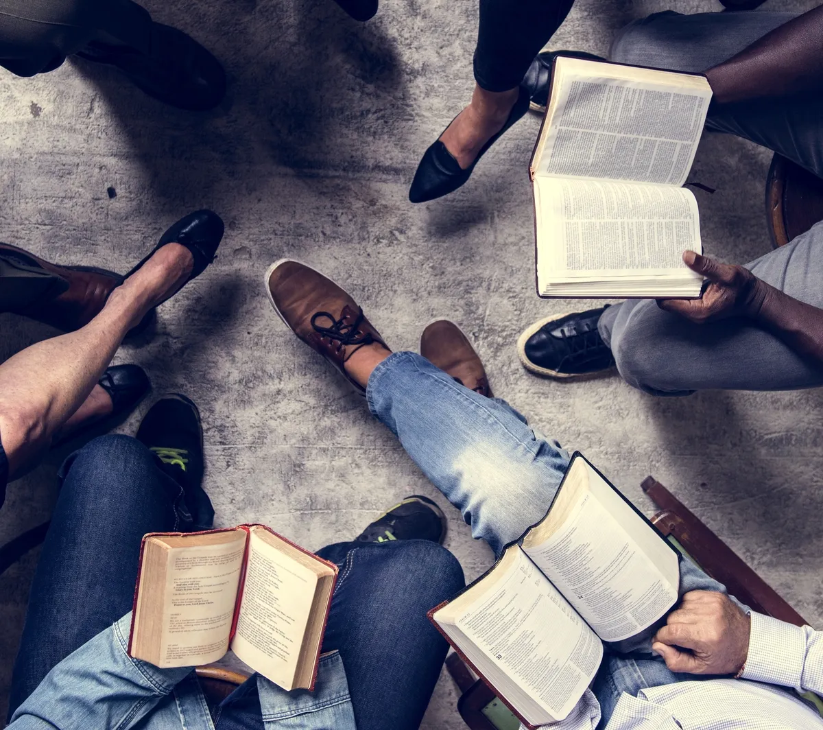 group of people reading in a circle