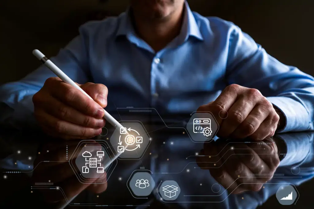 Business professional using a stylus on a digital interface with futuristic UX/UI icons.