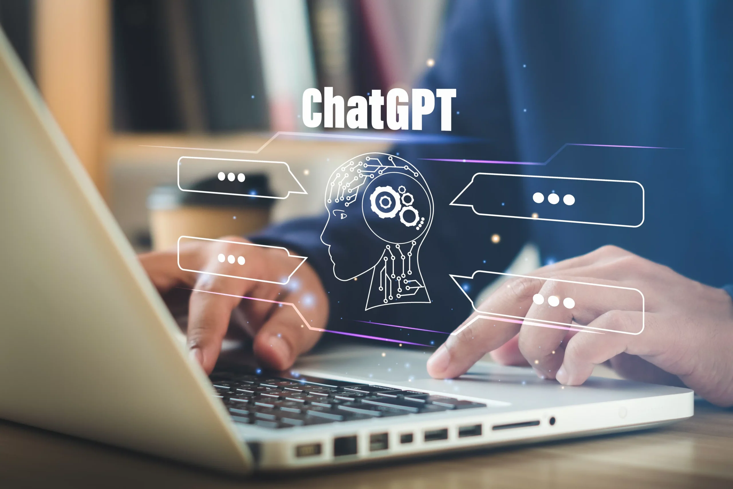 Person typing on a laptop with a futuristic AI chatbot interface labeled ChatGPT.